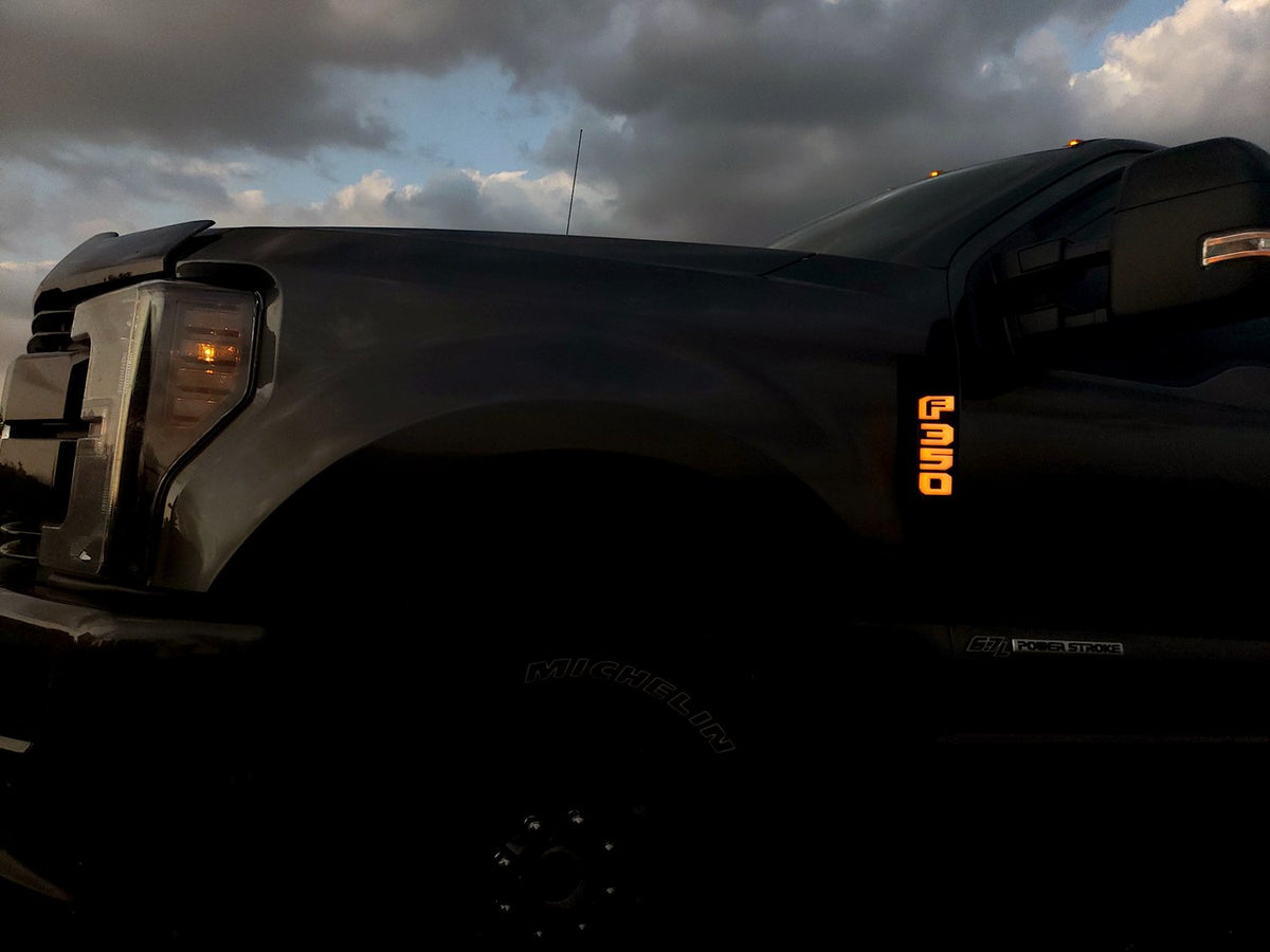 Ford F250 17-19 Illuminated Emblems Black Chrome in amber 2