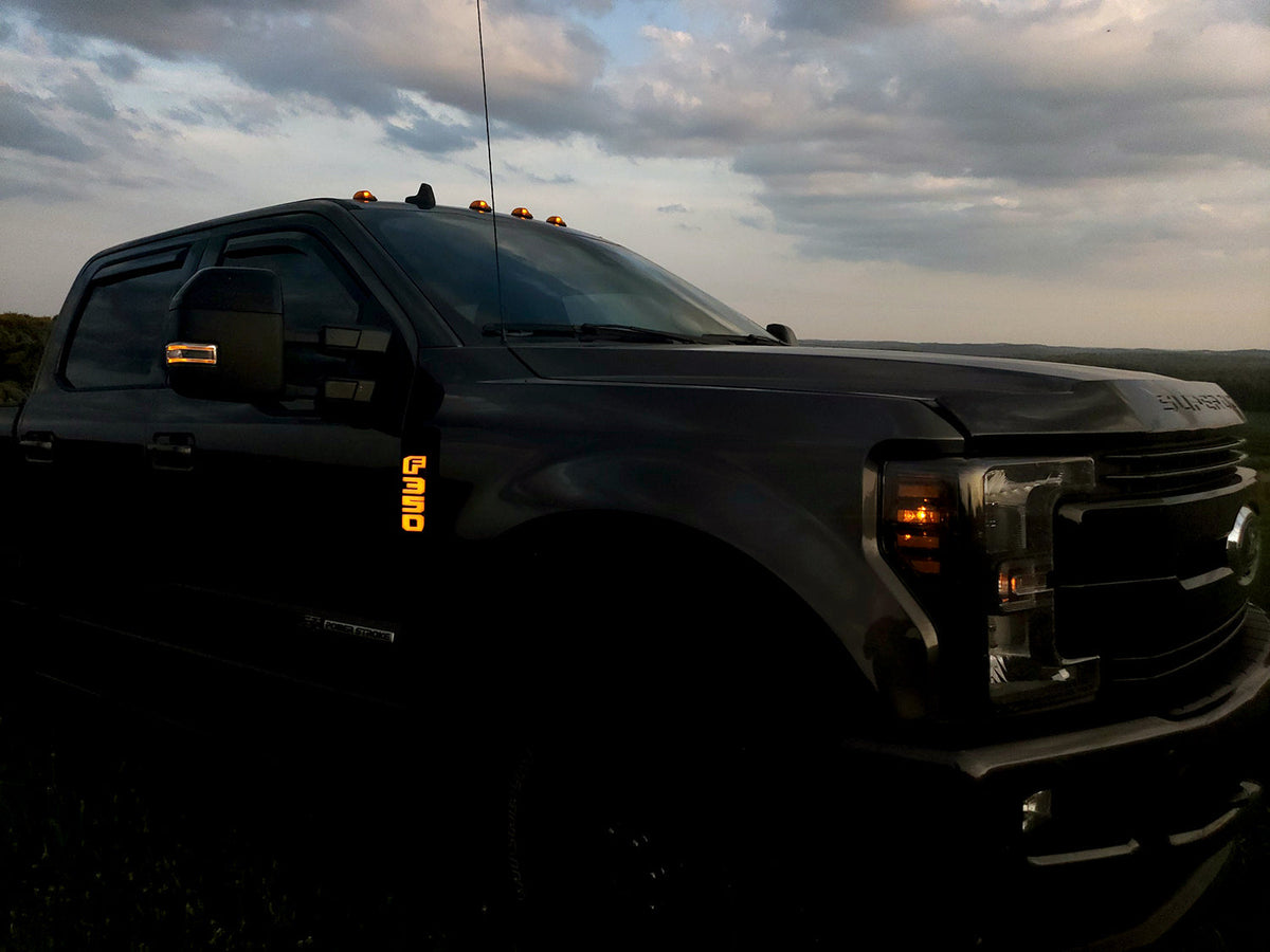 Ford F250 17-19 Illuminated Emblems Black Chrome in amber